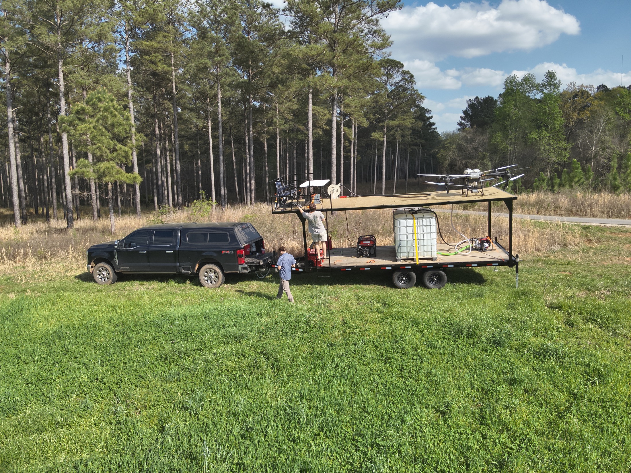 Elevated Ag field setup for pasture spraying in grassy rural acreage
